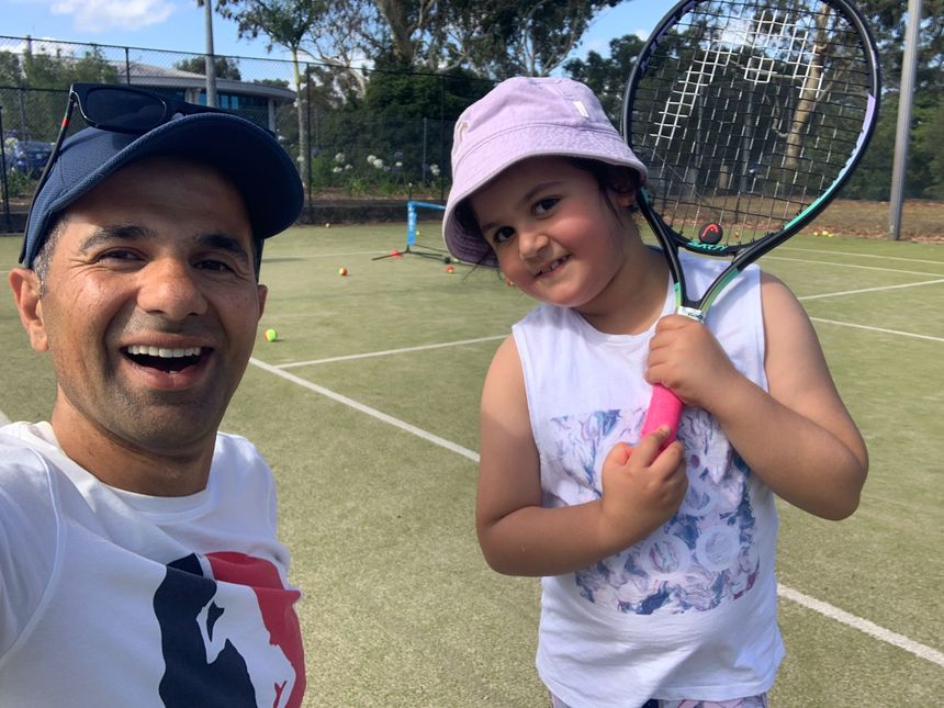 A young child starting out with a racquet